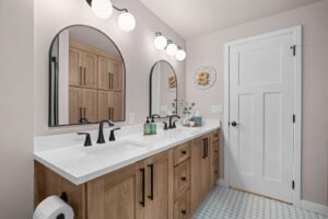 Bathroom remodel, vanity and mirrors beside the doorway