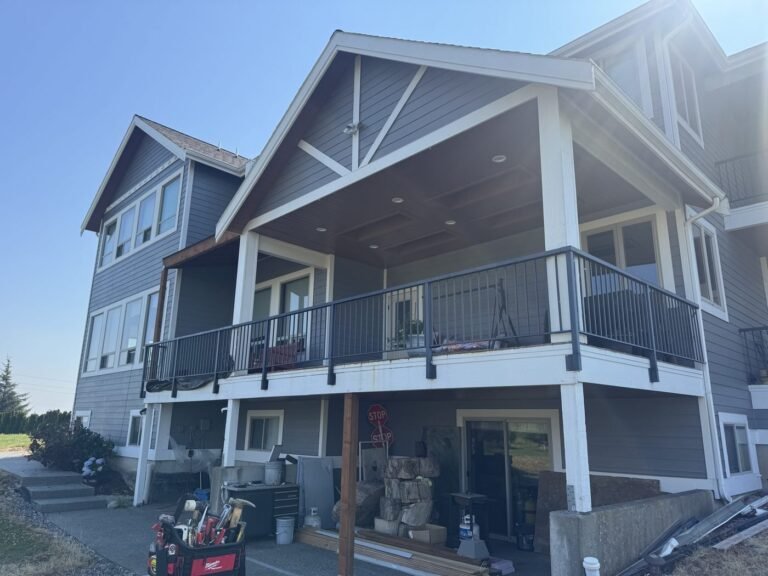 Covered and screened patio, two-storey exterior with new covered deck