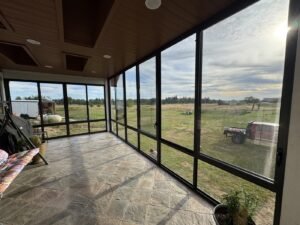 Covered and screened patio, interior looking out over open countryside