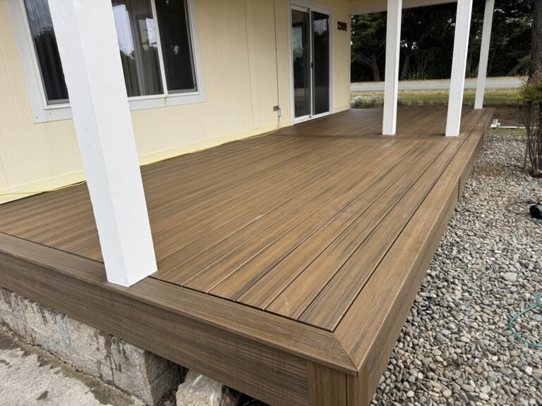 Deck rebuild, finished composite decking against the house