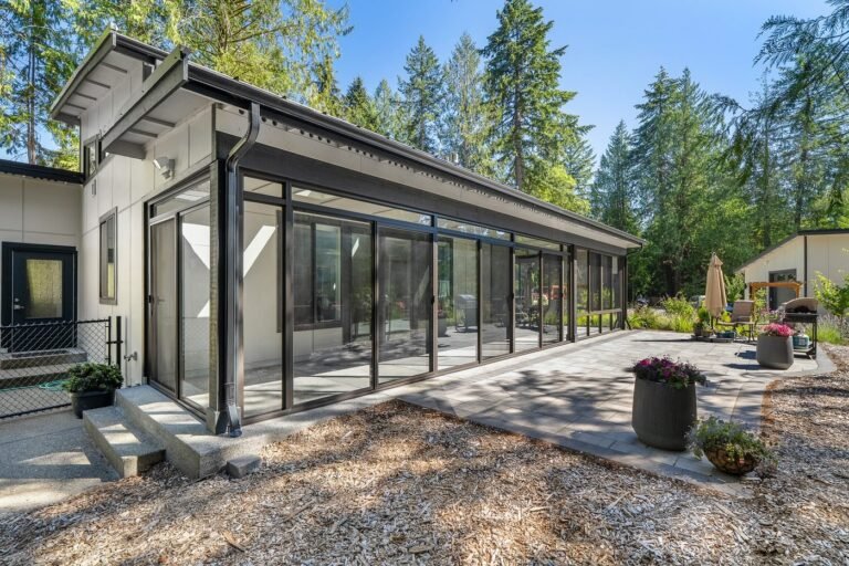 Glass patio enclosure, glazed exterior seen from the garden