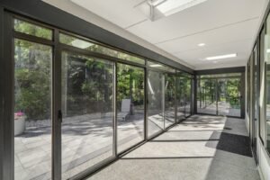 Glass patio enclosure, interior looking down the glazed walkway